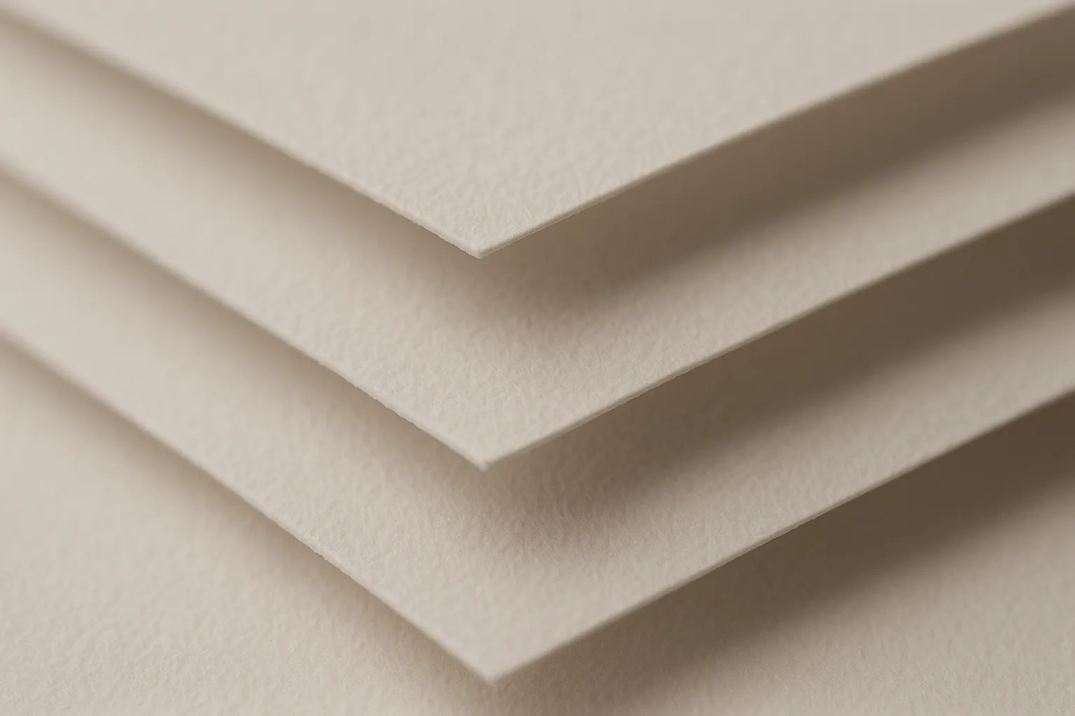 Close-up of layered paper sheets in monochrome